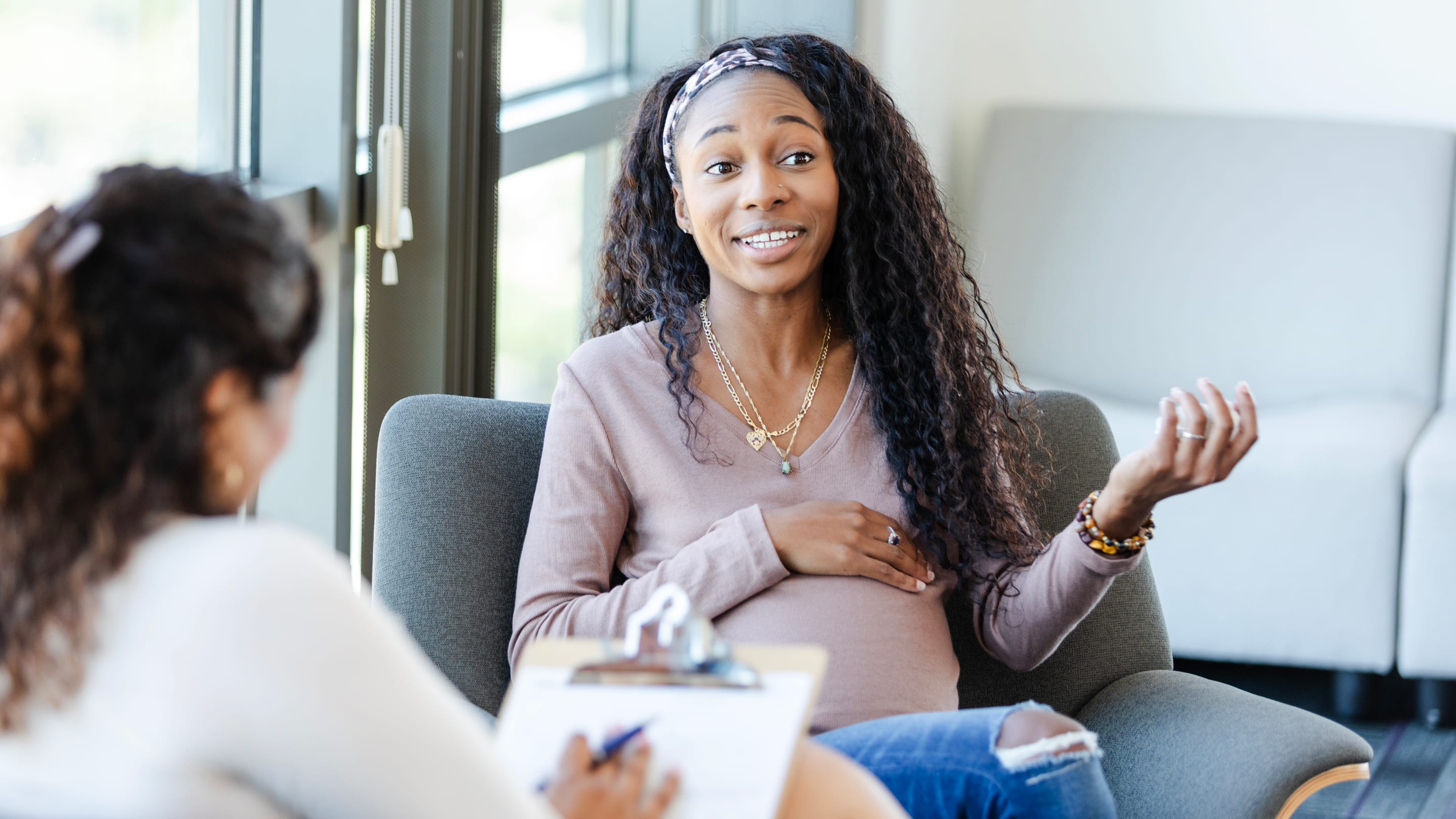 Physician providing care or consultation to a pregnant patient.