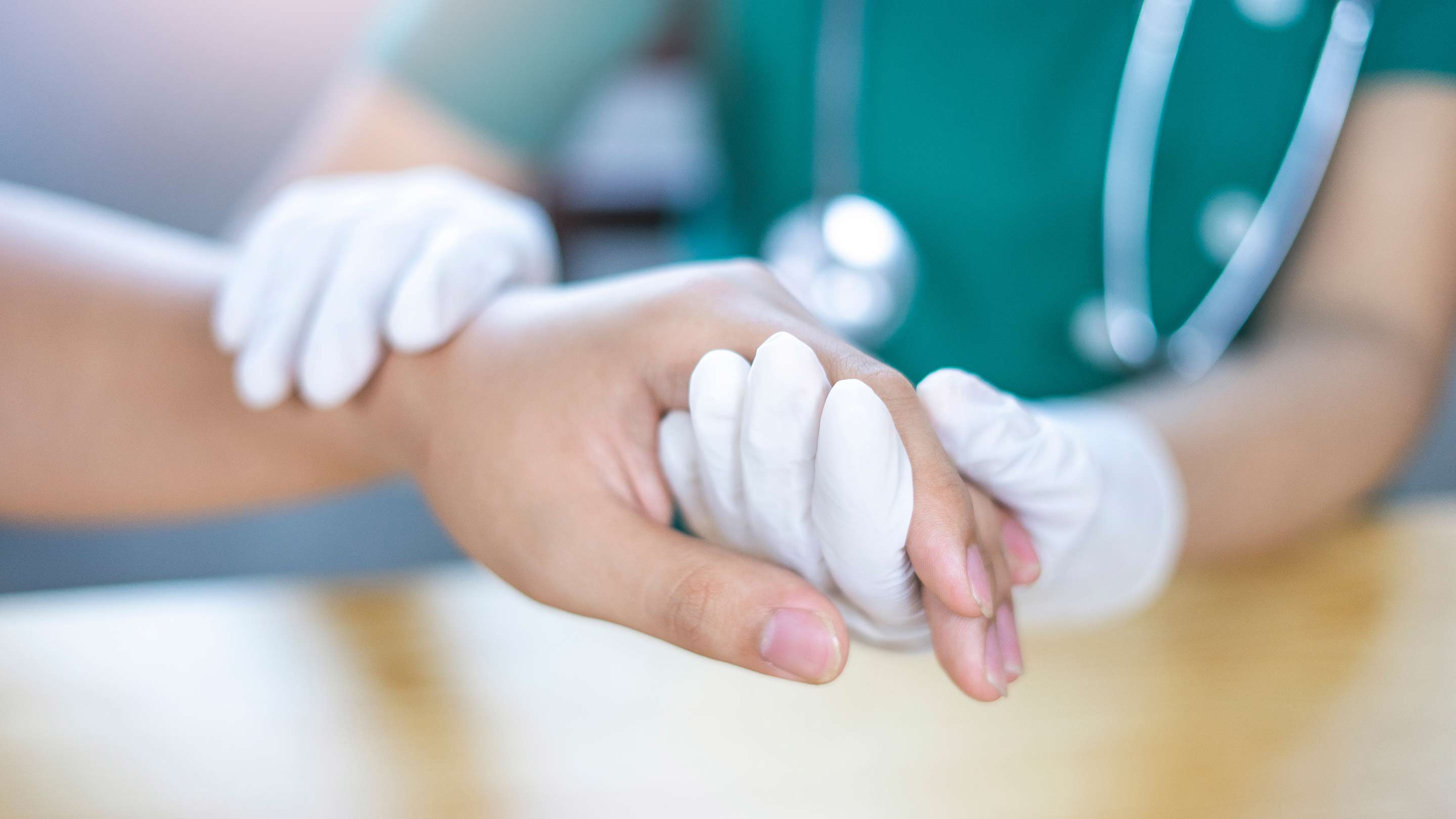 Close up of a doctor treating their patient.