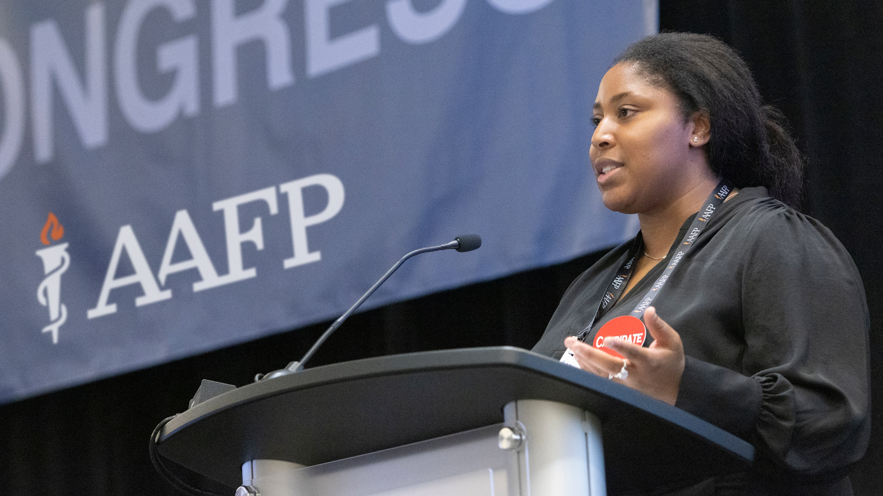 Image of a medical student leader speaking to a group.
