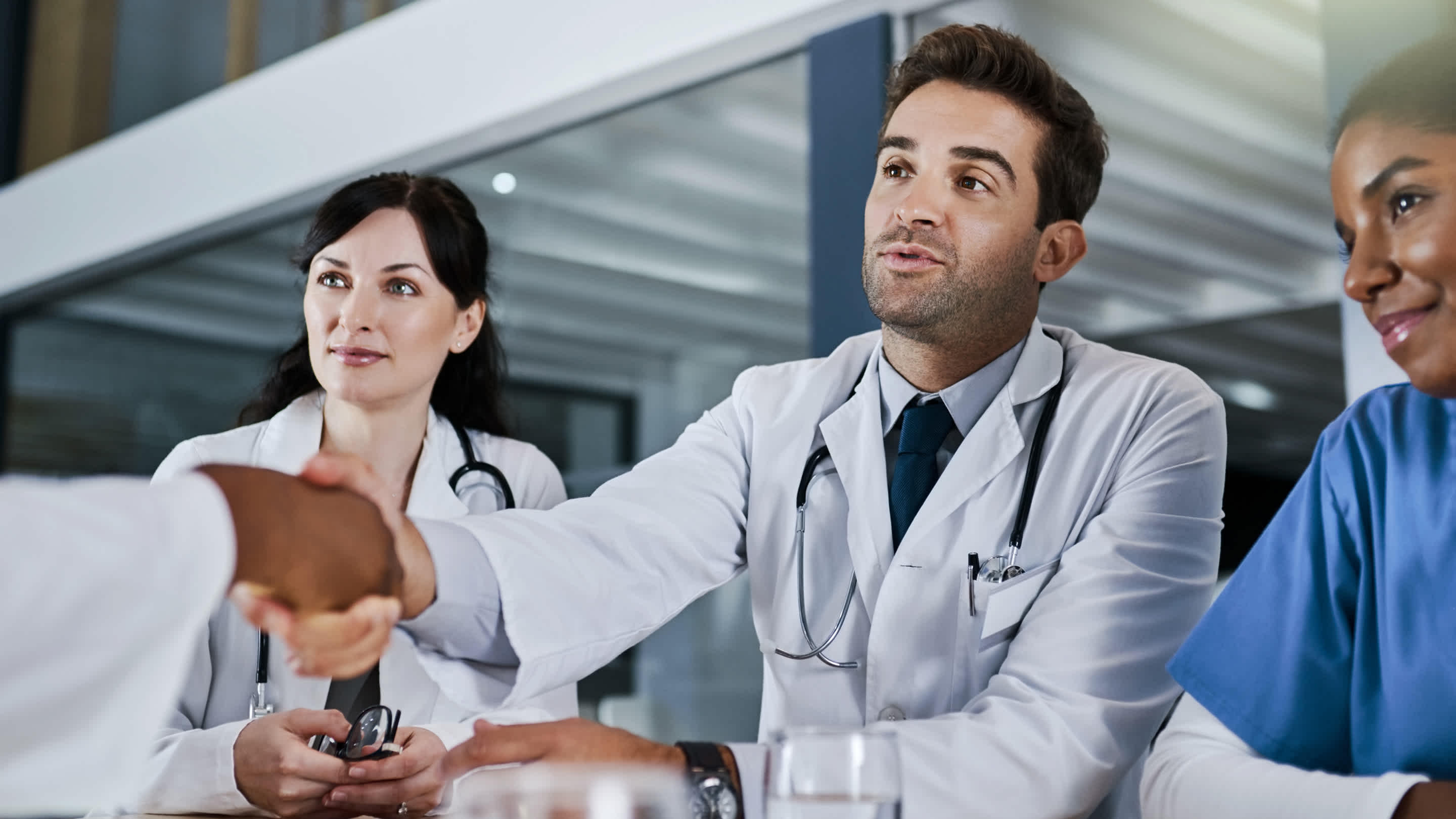 Physicians shaking hands after an interview