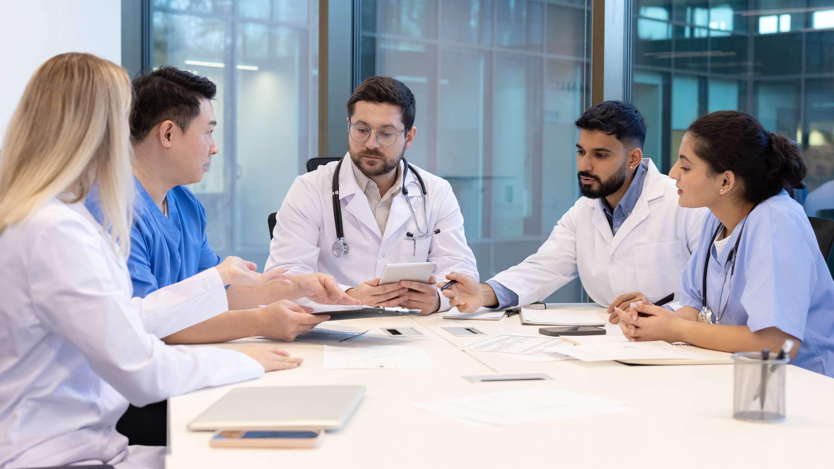 Public health staff review social determinant data and outreach materials