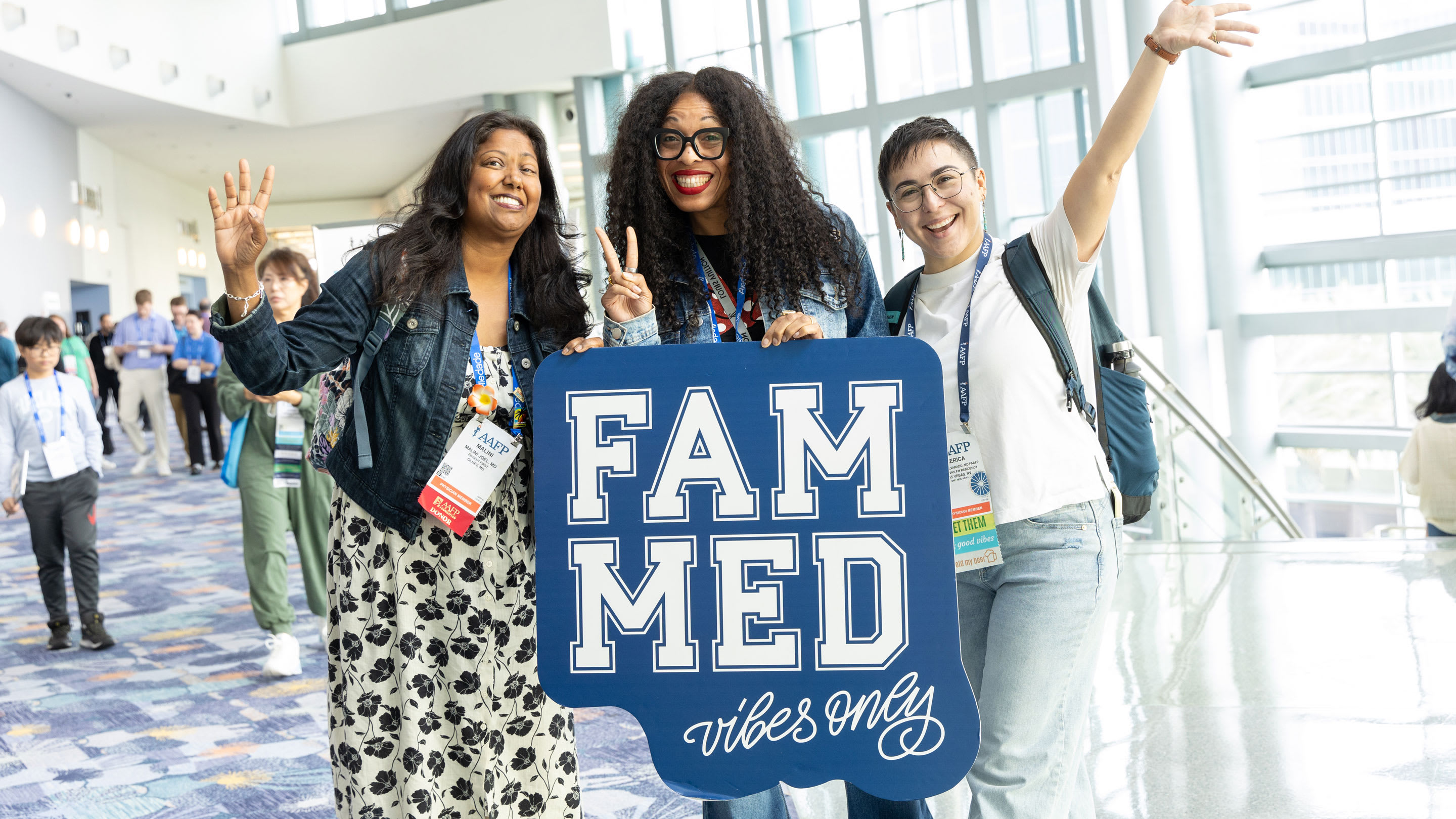 Image of AAFP FMX Attendee members holding Photo Props at FMX 2025 in Anaheim.