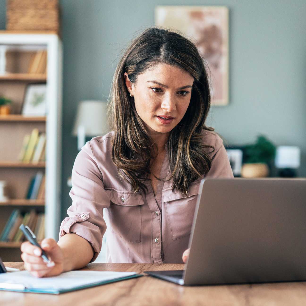 Female medical student attending a webinar on a laptop.