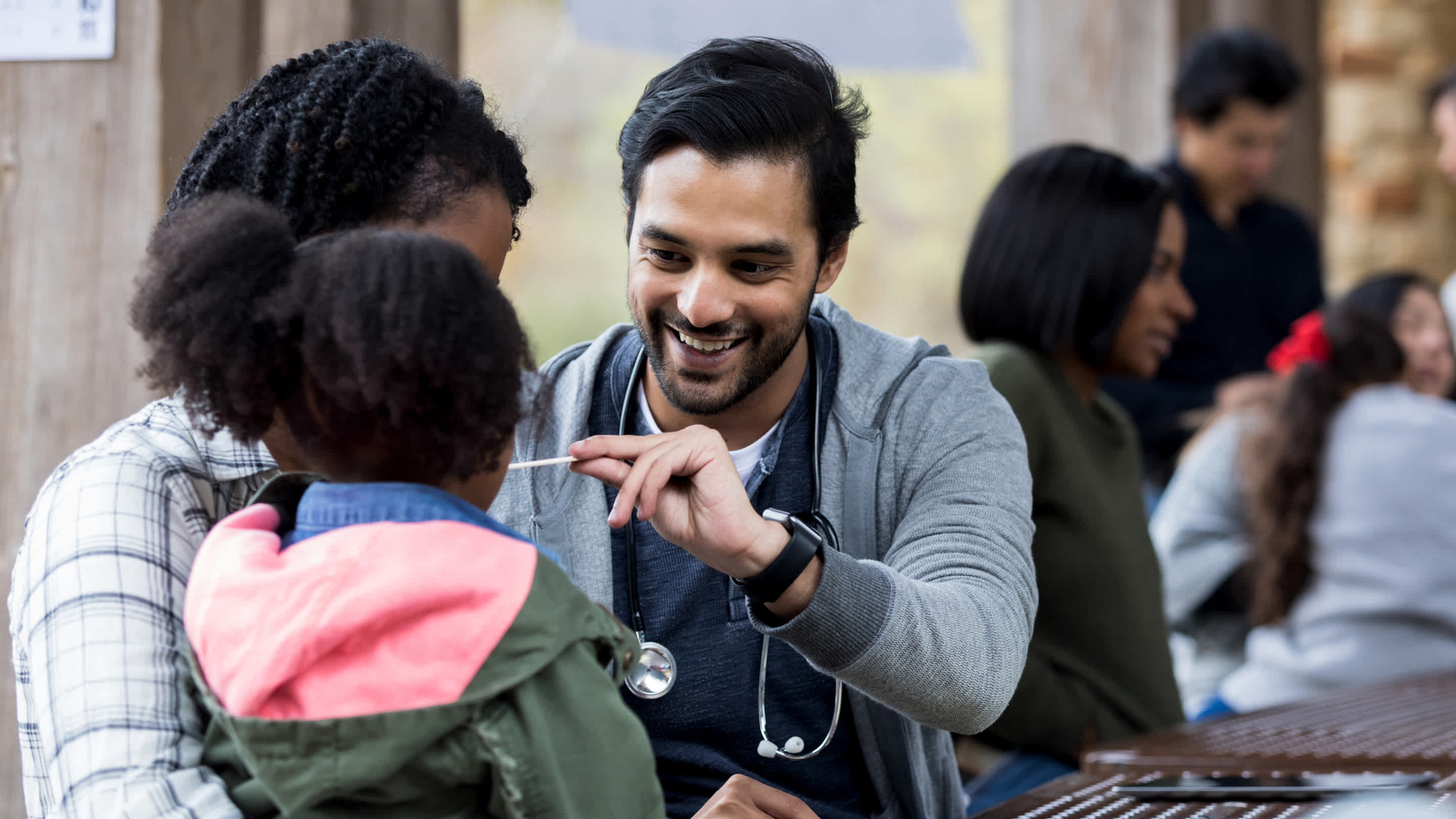Physicians volunteering at a community health event.