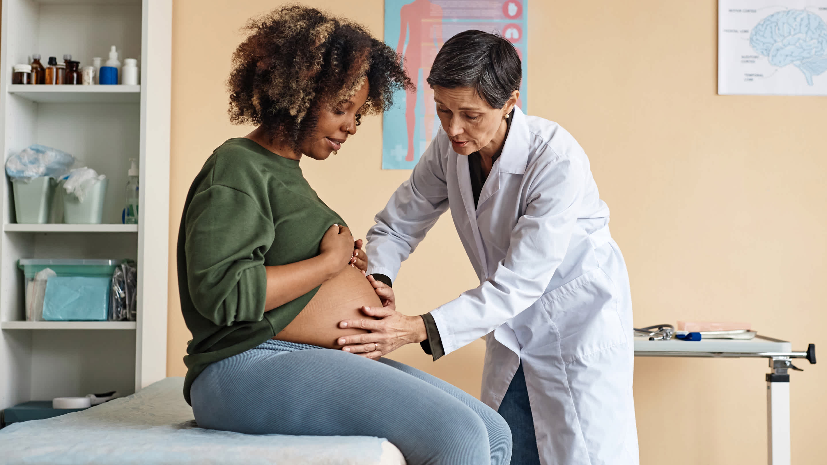 An image of a person working in obstetrics care with a pregnant patient.
