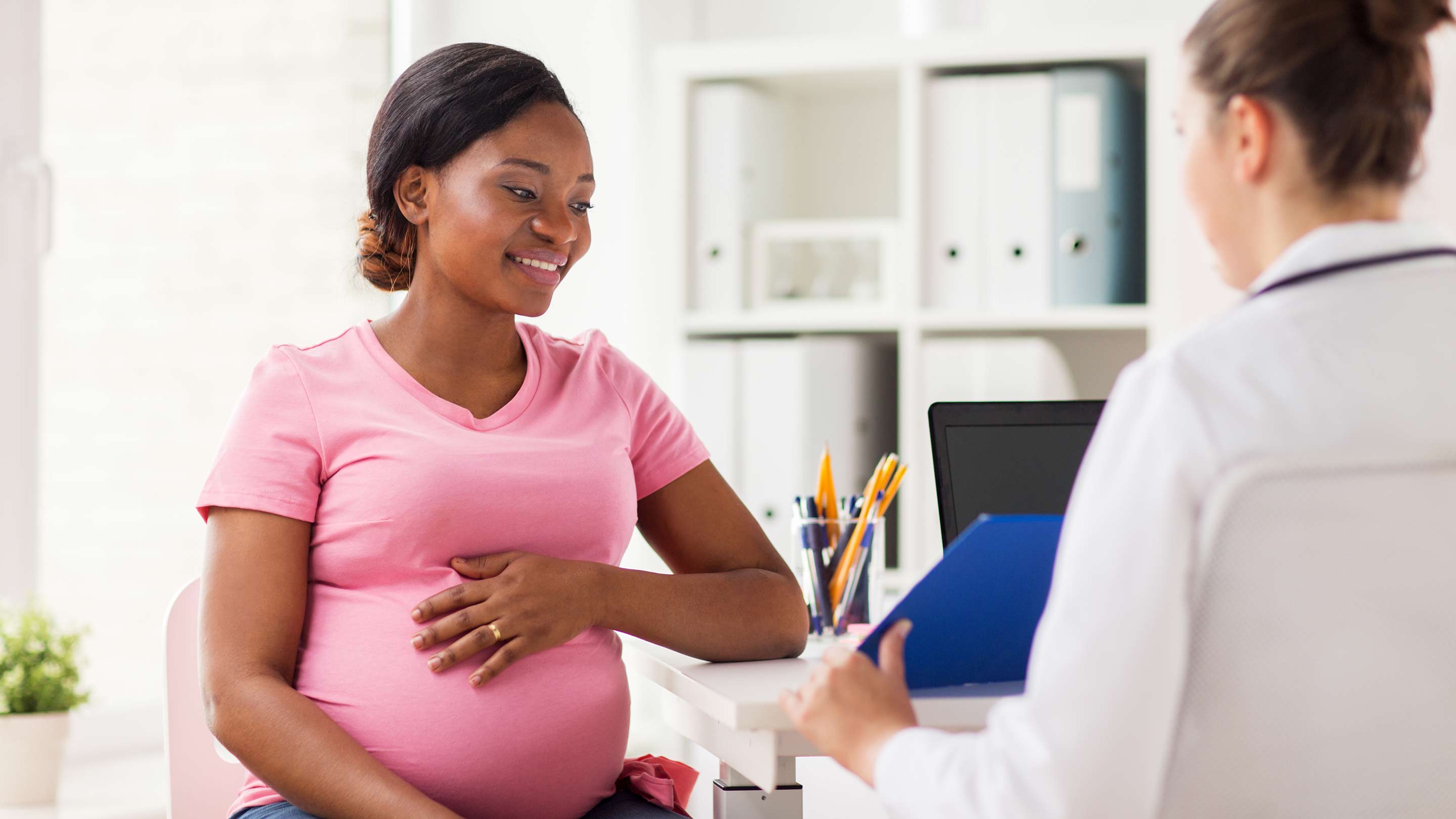 A doctor with a pregnant patient.