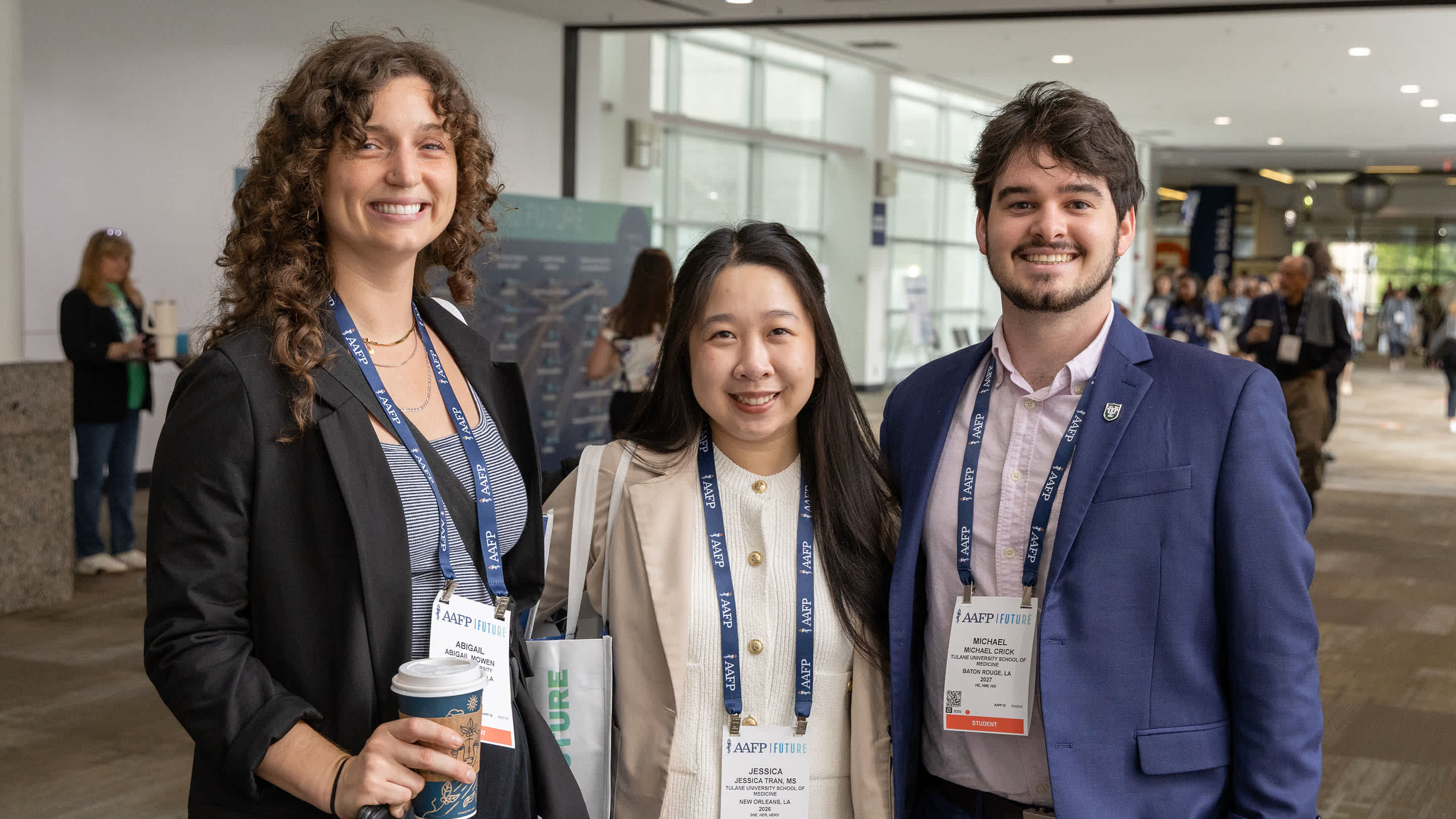 Three Future conference attendees stand together for a portrait.