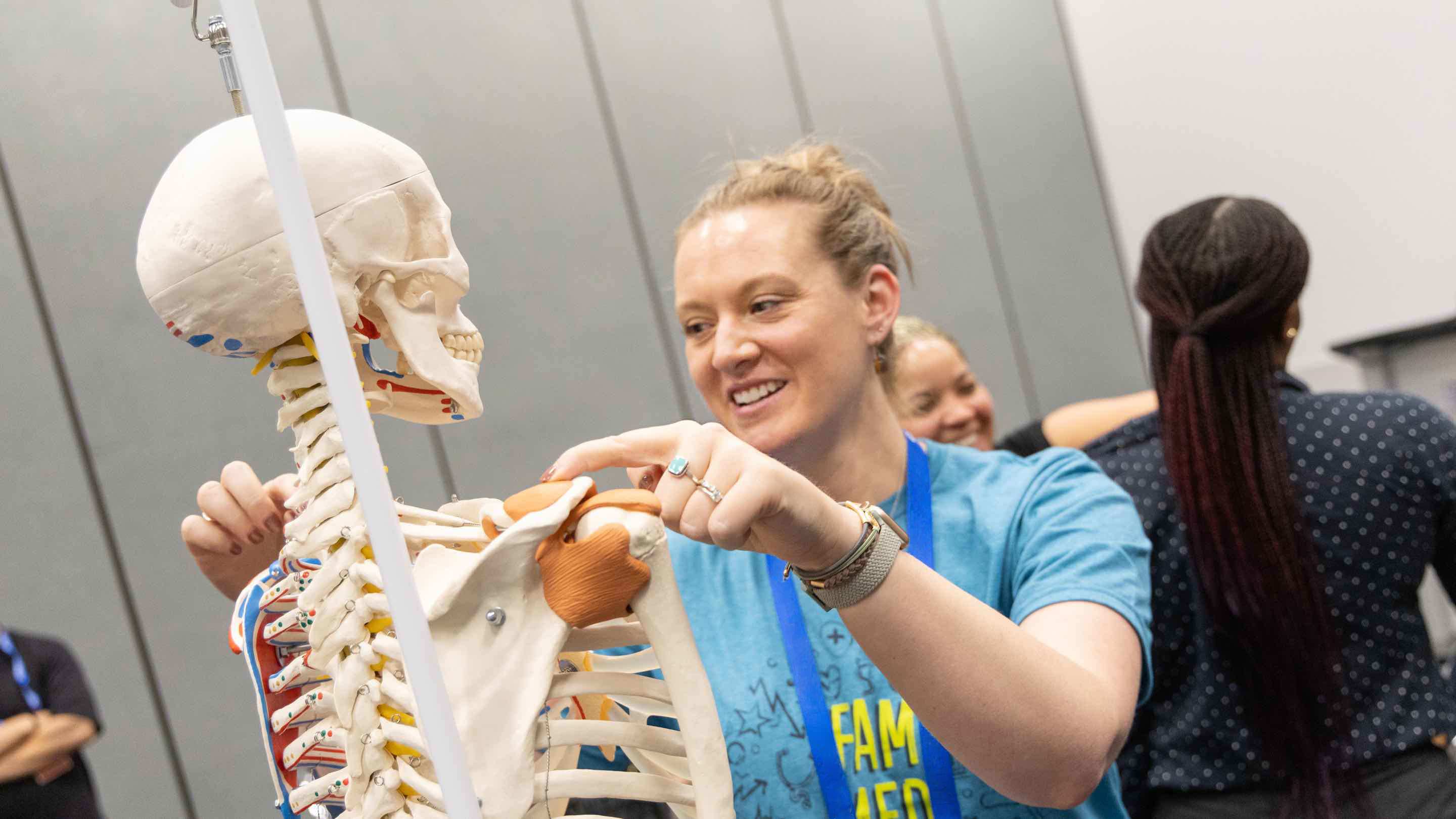 A woman examines an skeleton at FMX 2025.