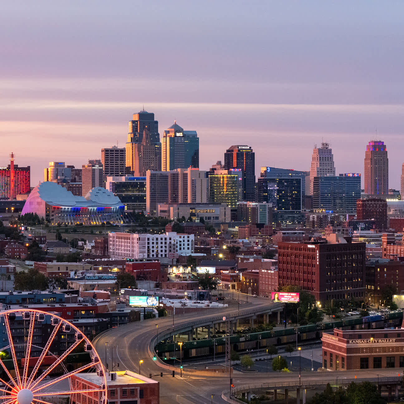 Aerial view of downtown Kansas City, Missouri skyline at dusk.