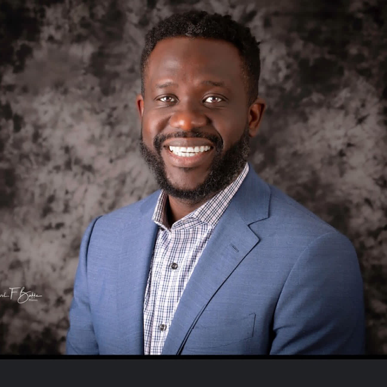 A portrait of Olusola Adegoke.