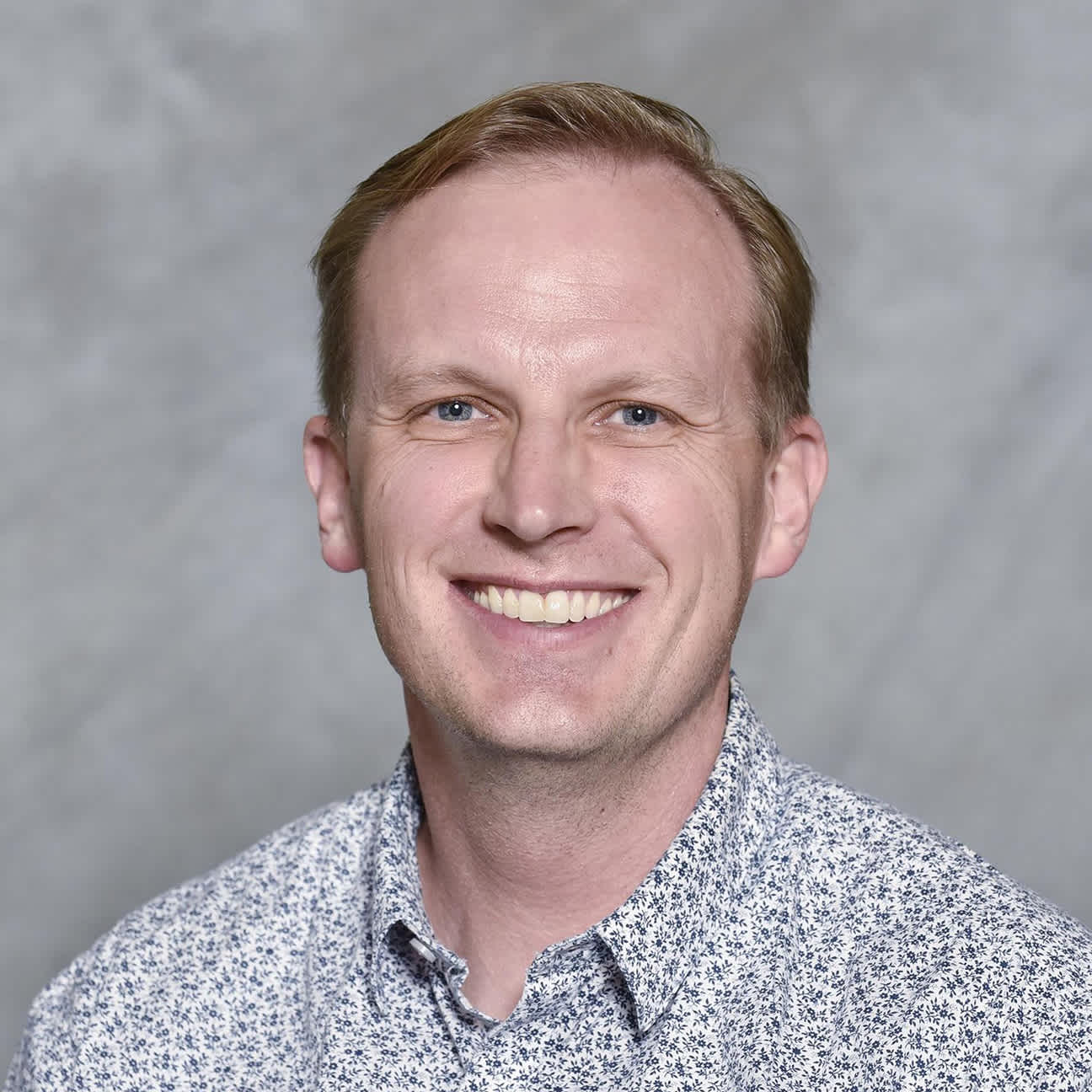 A headshot of Justin Bailey MD