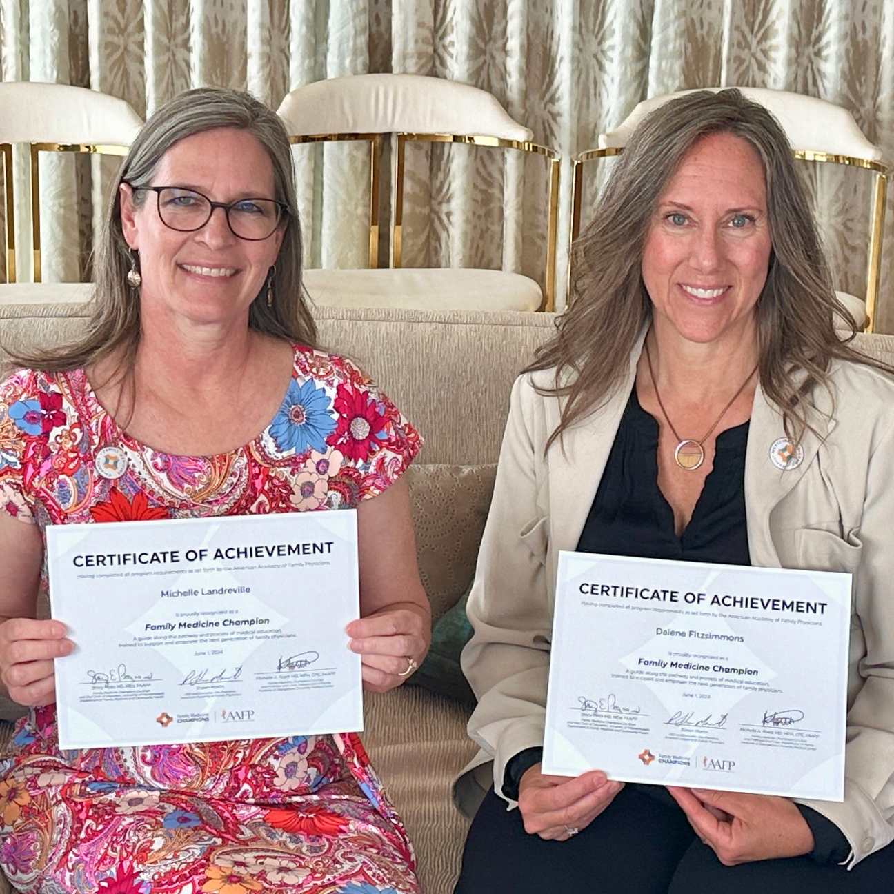 Family Medicine Champions graduates display their certificates for completing the program.